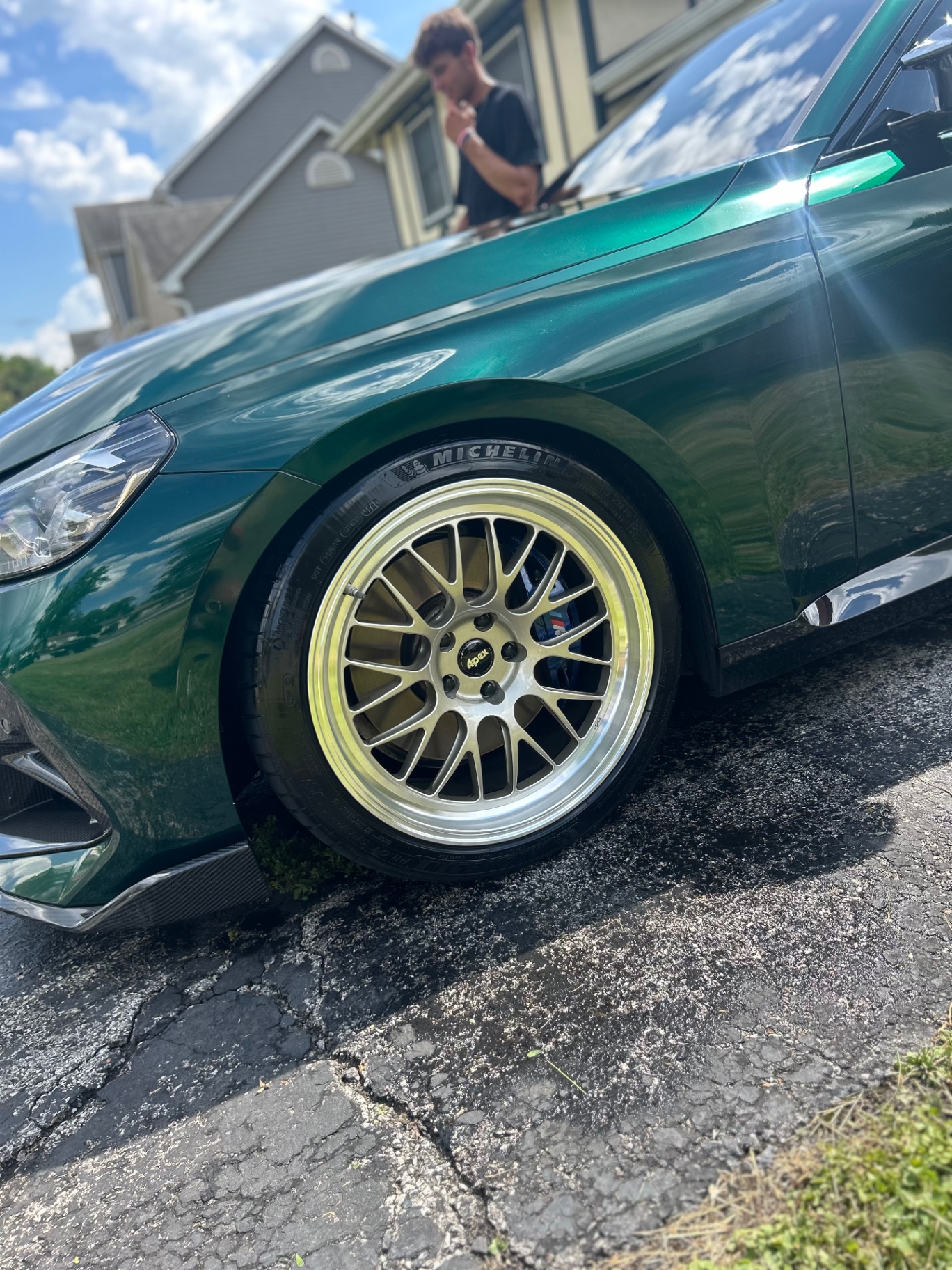 Emerald green sedan with polished paint and wheel detail