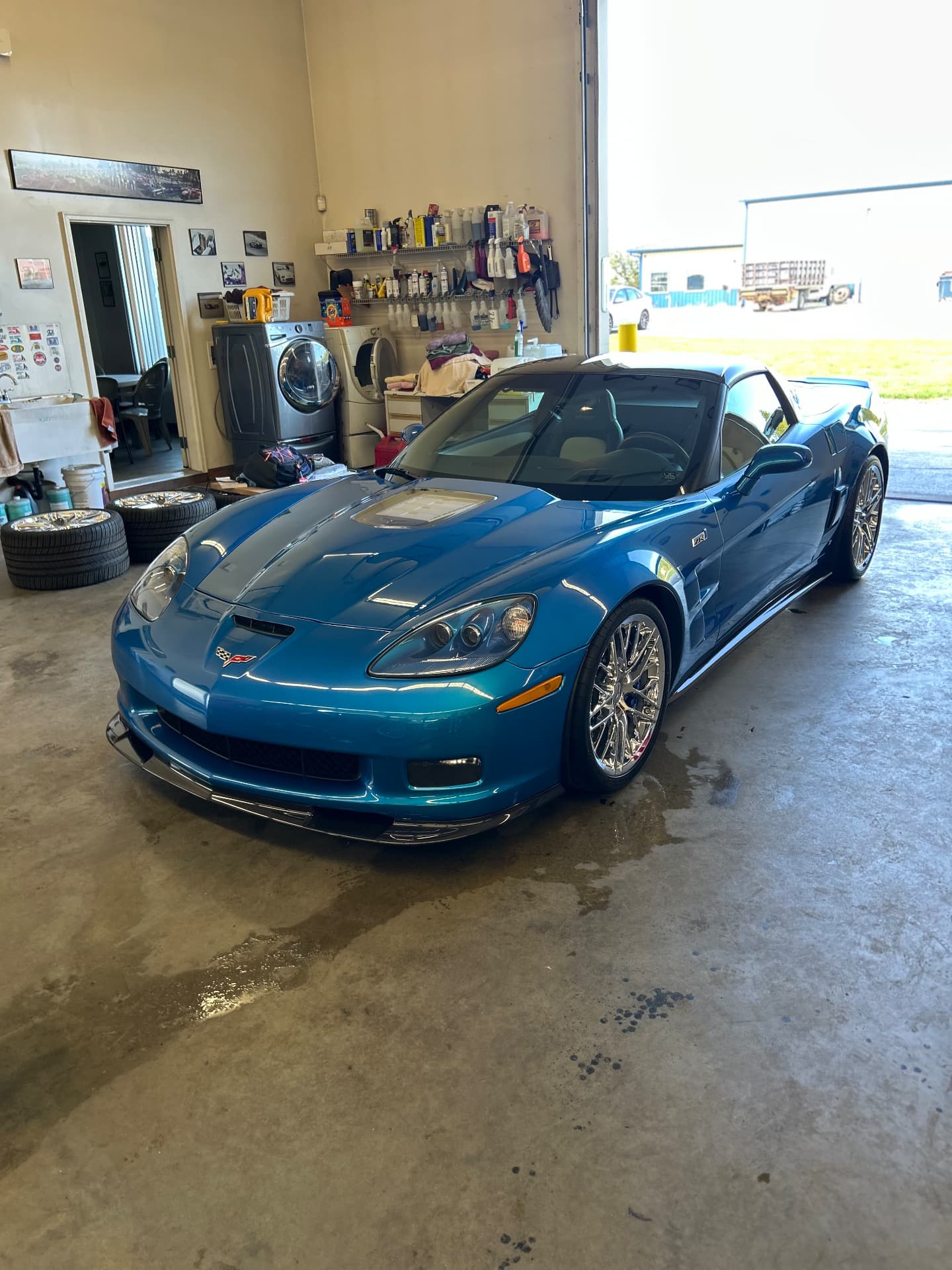 Blue Corvette with a glossy exterior in the garage