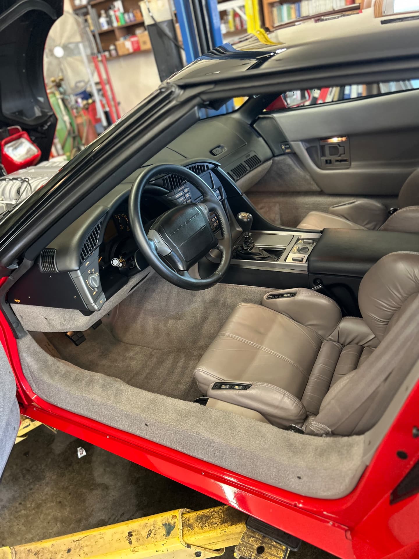 Red Corvette beige seats, dashboard and steering wheel
