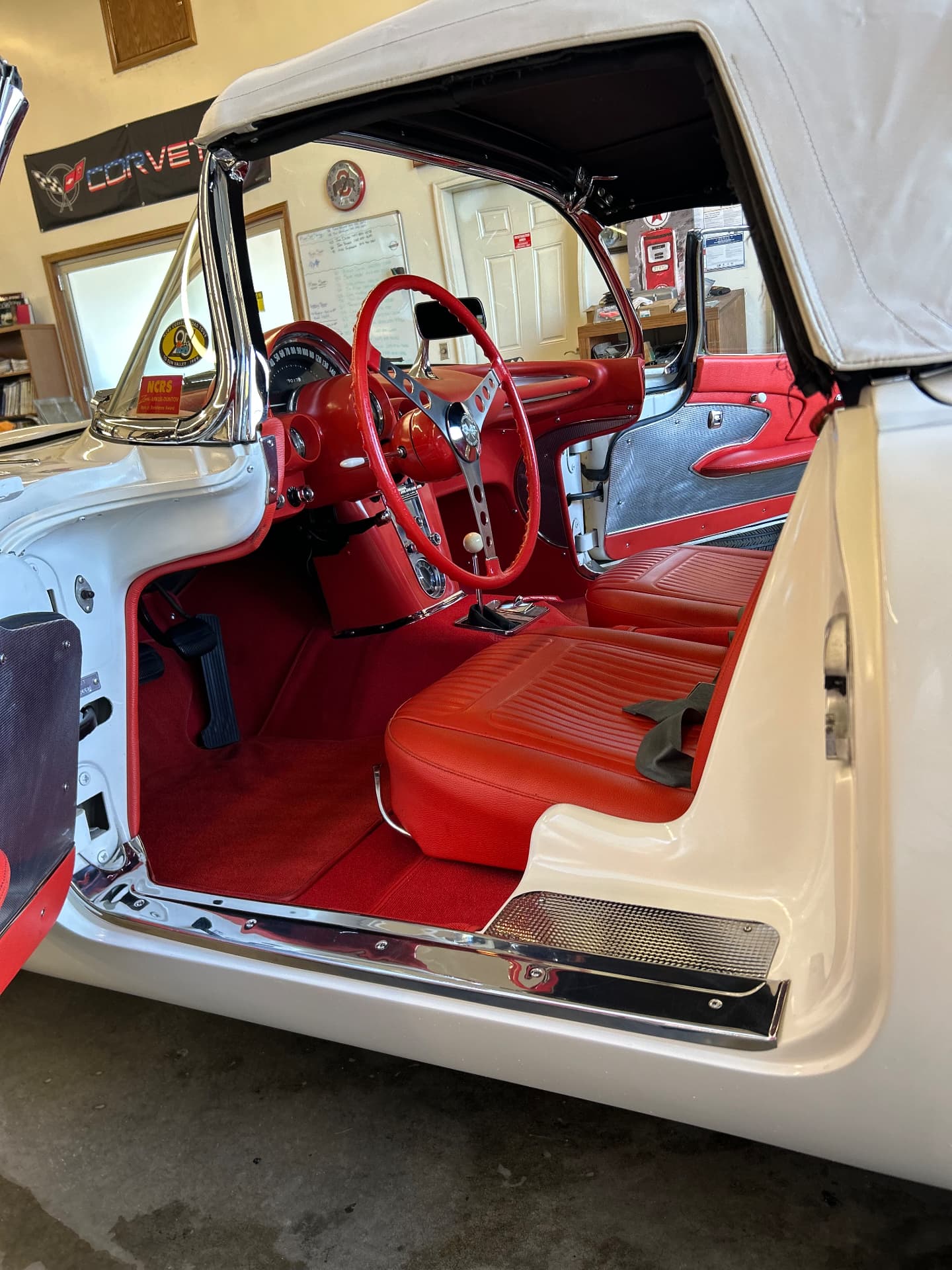 Classic Corvette red seats and steering wheel with the door open